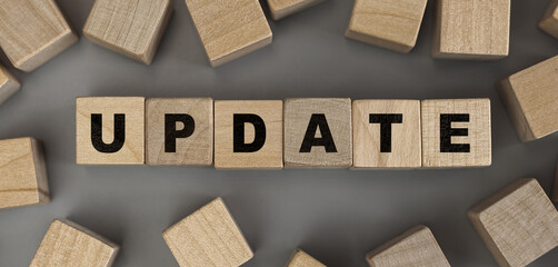 The word Update made from wooden cubes. Conceptual photo