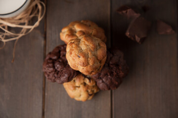 Cookies on a wooden table with pieces of chocolates
