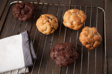 Cookies on oven wire rack on a wooden table