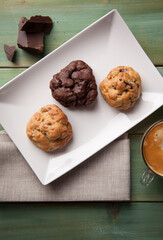 Cookies on a white plate with coffee latte
