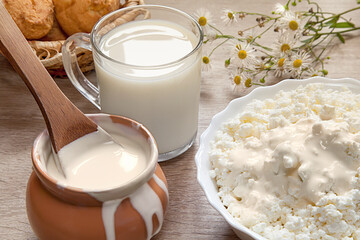 Natural homemade milk, sour cream, fresh curd. Healthy breakfast in a rustic style. Dairy.