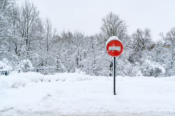 No entry road sign in deep snow