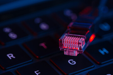 internet lan cable on the keyboard. Internet protection and security, hacking.