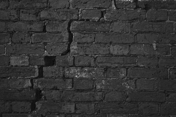 Dark Brick Wall With Big Crack Structure. Damaged Brickwork Surface Texture. Destroyed And Aged Old Bricklaying Rift Material.