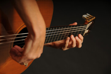 Obraz premium Close up of an acoustic guitar being played