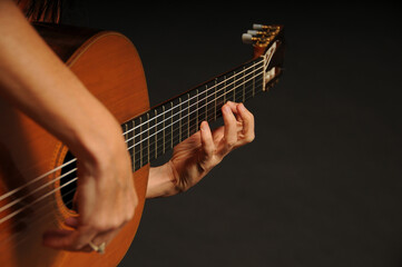 Fototapeta na wymiar Close up of an acoustic guitar being played