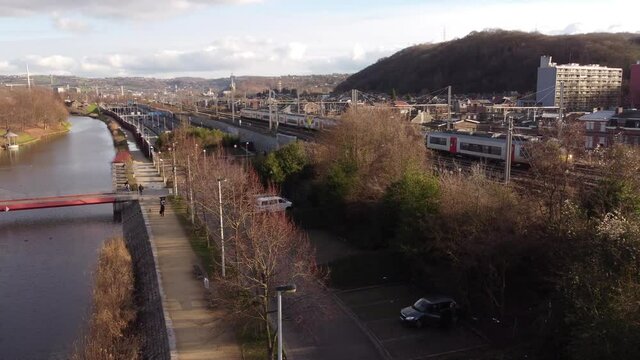 Belgium SNCB train pase over bridge, close to the Meuse River, january 22, 2021 Liege, Belgium