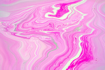 Fluid art texture. Closeup abstract pink, white and grey colors mixing of acrylic for use as background. Liquid acrylic artwork that flows and splashes with marble pattern