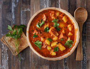 Potato stew with pork with toast