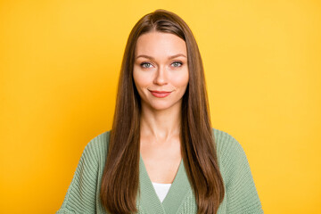 Photo portrait of beautiful young woman isolated on vivid yellow colored background