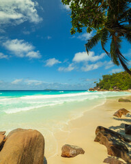 Bright daytime views of Anse Georgette paradise beach on the west coast of Praslin Island in the Seychelles 