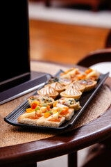 assorted of canapes on slate platter