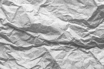 Grey crumpled paper textured background