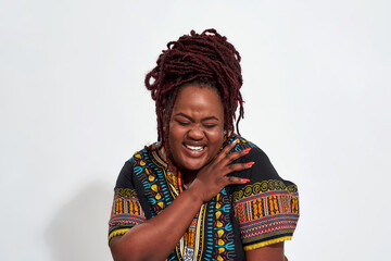 Portrait of plump young haitian woman laughing out loud - obrazy, fototapety, plakaty