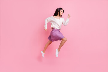 Full size profile side photo of young attractive beautiful pretty charming girl running in air isolated on pink color background
