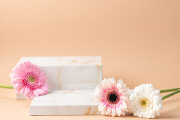Empty podium boxes for presentation of cosmetic products. Marble boxes and pastel flowers  beige...