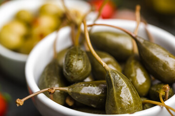 Green pickled Capers. Italian food ingredients.