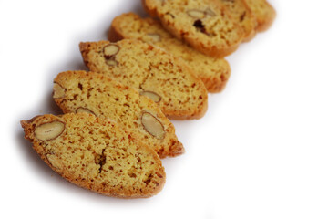 Traditional Italian Cantucci or Cantuccini cookies with almonds isolated on white background