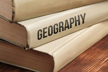 Geography subject book concept on a wooden table for learning.