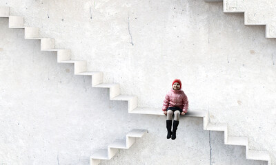 Dreamy little girl sitting ready for adventure