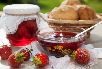 Homemade strawberry jam and fresh strawberries. Rustic style.Selective focus