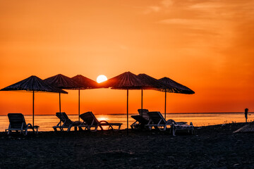Beach umbrellas at sunrise