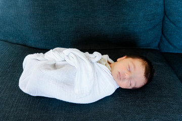 Swaddled newborn baby sleeping