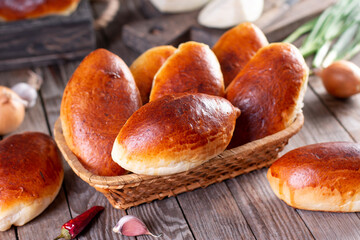 Traditional homemade pies with filling. Pies with cabbage. Russian piroshki (patties) © qwartm