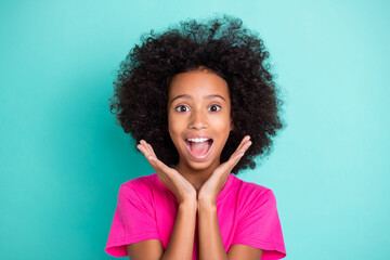 Photo portrait of excited afro american girl screaming with palms near face isolated on vivid cyan...
