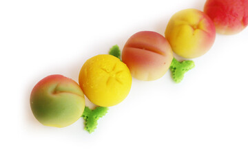 Traditional Italian Marzipan fruits isolated on white background. Sweet Marzipan shaped like fruits from Sicily