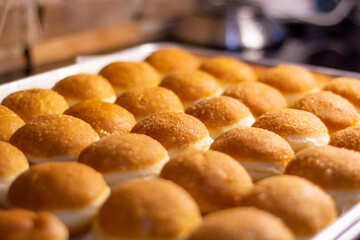 close up photo of fried doughnut with beautiful dark brown color
