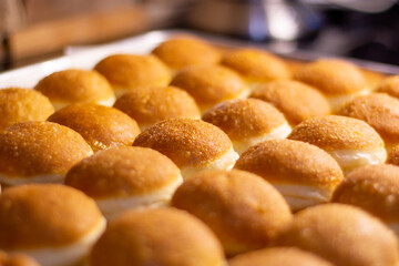 close up photo of fried doughnut with beautiful dark brown color