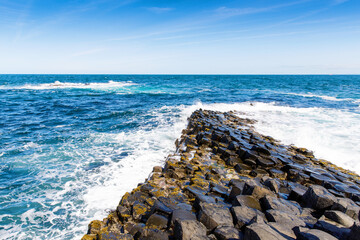 Landscape of Giant's Causeway trail with a blue sky in summer in Northern Ireland, County Antrim....