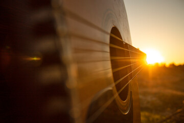 Guitar during the sunset.Playing guitar with some friends during the golden hour in the nature,just...