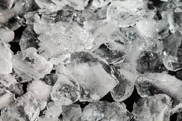 Broken crushed ice for cooling drinks on a black background