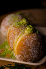 close up bombolonie on wooden plate in the table