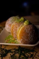 close up bombolonie on wooden plate in the table