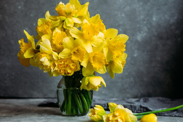 Bouquet of yellow daffodils on a dark background