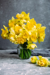Bouquet of yellow daffodils on a dark background