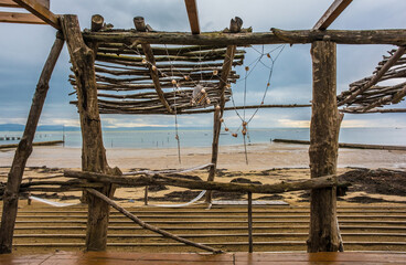 Winter on a popular each near Grado, Friuli-Venezia Giulia, north east Italy. A makeshift beach bar has been dismantled until the summer season starts again
