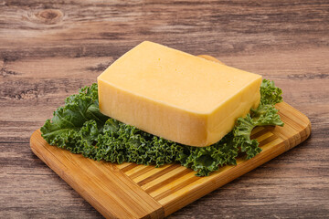 Tasty yelloow Tilsiter cheese brick