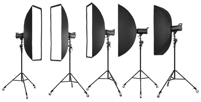 Photo studio lighting stands with flash and softbox isolated on the white.