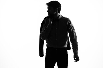man in a suit holding a jacket in his hands emotions profile silhouette shadow