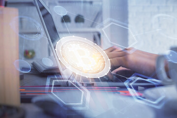 Double exposure of woman hands typing on computer and crypto market theme hologram drawing. Blockchain concept.