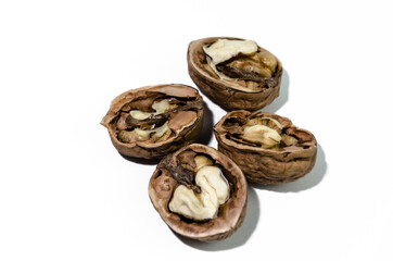 Open walnuts on white background, clipping path