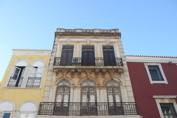Colourful portuguese buildings against blue sky