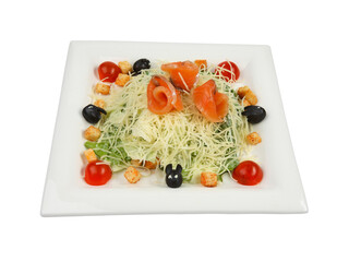 Salmon caesar salad on white square plate isolated on white background