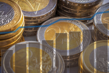 Euro coins in stacks with history chart and bar graph. Presentation for investments with yield. For background.