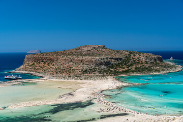 Amazing Panoramic view of Balos Lagoon near Chania, with magical turquoise waters, lagoons, tropical beaches of pure white, pink sand and Gramvousa island on Crete, Cap tigani in the center. Greece