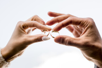 guy and a girl stretch out their hands to each other